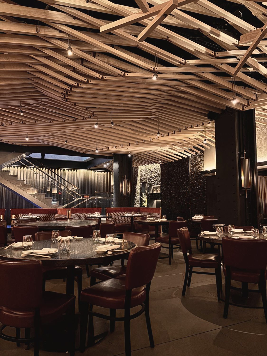 A timber ceiling and low lamplight