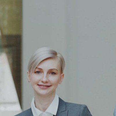 Hannah, a smiling instructor with short blonde hair