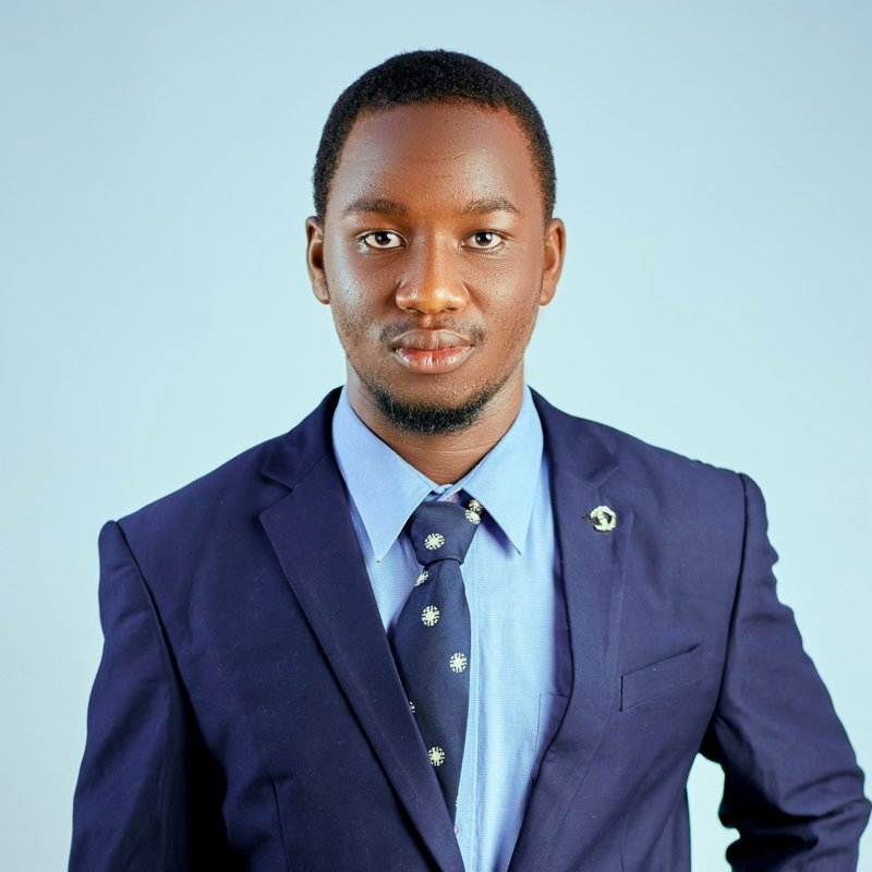 Marcus, a smiling instructor in a navy suit