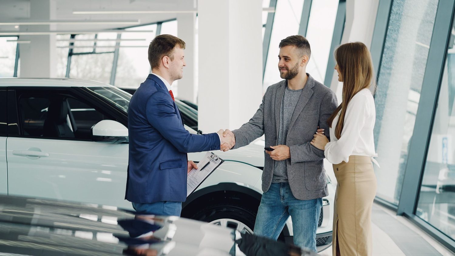 An instructor shaking hands with a happy learner