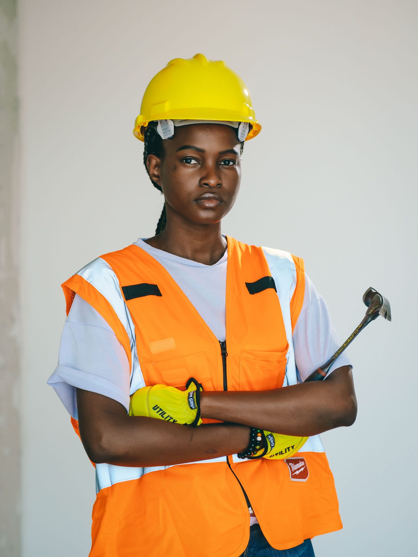 Our lead electrician in an orange vest with arms crossed
